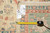 Back of rug with tape measure and tag confirming 8'1" x 10'8" hand-woven Oriental rug