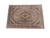 Angled studio shot of large brown Tabriz rug showing ivory guard borders and navy spandrels