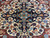 Navy medallion core with turquoise rosettes and ivory petals in hand-knotted fine Persian wool