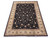 9x12 hand-knotted wool and silk Oriental rug angled on white, black field, ivory fringe