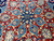 Detail of medallion core showing 8 petal rosette, sky blue palmettes and hand-knotted wool pile