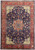 Navy blue 10x13 Persian Isfahan rug with red floral medallion and ivory corner spandrels