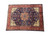 9'7" x 12'9" Persian Isfahan Najafabad rug photographed at an angle on white studio background