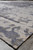 Low angle view along the 10'1" x 14' rug showing silky sheen and neutral palette