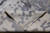 Folded corner showing the reverse of the modern rug and its fine knot structure