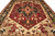 Wide view of the burgundy field, stepped medallion and blossoming ivory corner spandrels on this rug
