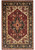 Full view of the 10' x 15' Serapi Heriz rug with burgundy field and black border