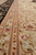 Low angle border detail showing beige guard stripes, pink outlines and silk highlighted flowers