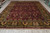 Full length 9'11" x 13'10" Jaipur rug displayed flat with ivory fringe and green border