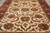 Cream field close view showing rosettes, serrated leaves and curling vine scrollwork in wool