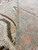 Detail of soft wool surface and thin antique pile showing salmon accents against celadon green