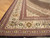 Corner detail of ivory border with green and rust palmettes and narrow guard stripes