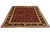8'3" x 10'2" wool and silk rug photographed at an angle showing burgundy field and rosette border