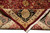 Folded corner revealing tight hand-knotted backing, silky wool pile and cotton fringe on the reverse