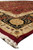 Angled corner shot highlighting ivory guard border, burgundy edge and hand-knotted cotton fringe of the rug
