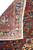8x11 Persian rug folded to show tight hand-knotted cotton foundation and crisp back design