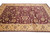 Wide gold border and burgundy floral field of this 10 x 13.8 ft large area rug