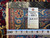 Back tag reading rug number 6663, size 6.10 x 10.5, with tape measure on foundation