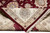 Folded corner revealing dense knotting, wool and silk pile, ivory border and hand-tied fringe