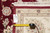 Reverse side with rug tag and tape measure showing knot density of this 10x14 rug