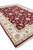 Angled corner view of hand-knotted wool and silk rug with ivory fringe and guard borders