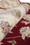 Rolled edge close-up showing silky sheen of ivory border florals against deep ruby field