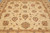Field detail with scrolling vines, rosettes and serrated leaves in muted earth tones