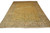 9'8" x 13'8" Persian Kashan rug photographed at an angle showing golden field and beige borders