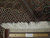 6'6" x 8'4" hand knotted Persian rug edge and fringe shown beside a 12 inch ruler