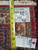 Back of the rug with measuring tape and tags confirming hand-knotted weave and rug number 5959