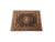 7'9" x 10' hand-knotted wool and silk rug laid flat on white studio floor