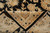 Folded corner revealing even hand-knotted back and fine wool pile in the ivory main border