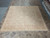 Neutral 10x10 square area rug photographed flat, suited to a dining room or open living space