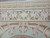 Border close-up showing ivory vine panel, rose buds and pink ribbon streamers above a cornucopia