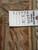 Back tag reading Genuine Hand Woven Oriental Rug, number 6356, size 8 x 10, with loose wefts