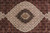 Close-up of ivory and black central medallion with rosettes and diamond lattice in silk highlighted wool