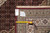 Reverse side with warehouse tag noting Mahi design and a tape measure across knot rows