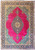 Magenta field Persian Tabriz rug with navy floral medallion and turquoise spandrels, full overhead view
