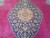 Central navy medallion detail with gold 8 petal rosette, pink flowers and ivory vinework