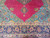 Lower pendant medallion, turquoise floral corner and navy border of the 9x13 Persian wool rug