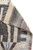 Corner fold revealing flat woven kilim end finish, grey fringe and dense charcoal ivory knotted pile