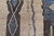 Detail of abstract diamond and wavy line motifs in blue, charcoal and ivory hand-spun wool