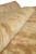 9 x 12 hand-knotted wool rug rolled back to show soft pile depth and sheen