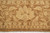 Main border close-up with cream palmettes, curling leaves and brown ground on this Peshawar rug