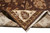 Folded back corner revealing the cotton foundation and even hand-knotted weave of this Indian rug