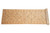 Side view of the extra long runner partly rolled, revealing sage green palmettes on a beige field