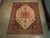 8'2 x 10'3 Persian Ardebil rug displayed flat on light oak floor showing full geometric layout