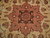 Close-up of the brown and salmon stepped centre medallion with 8 petal rosette and sage leaves