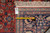 Back of the rug with tag F-4523, tape measure and visible hand-knotted weave