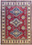 Deep red Kazak rug with three blue and ivory stepped medallions and ivory rosette border
